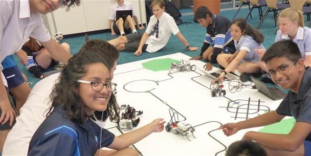 Image of students and robotic cars