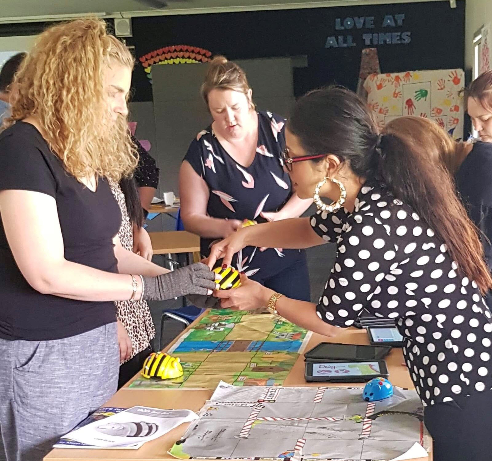 Conference leader working at a long tressle table