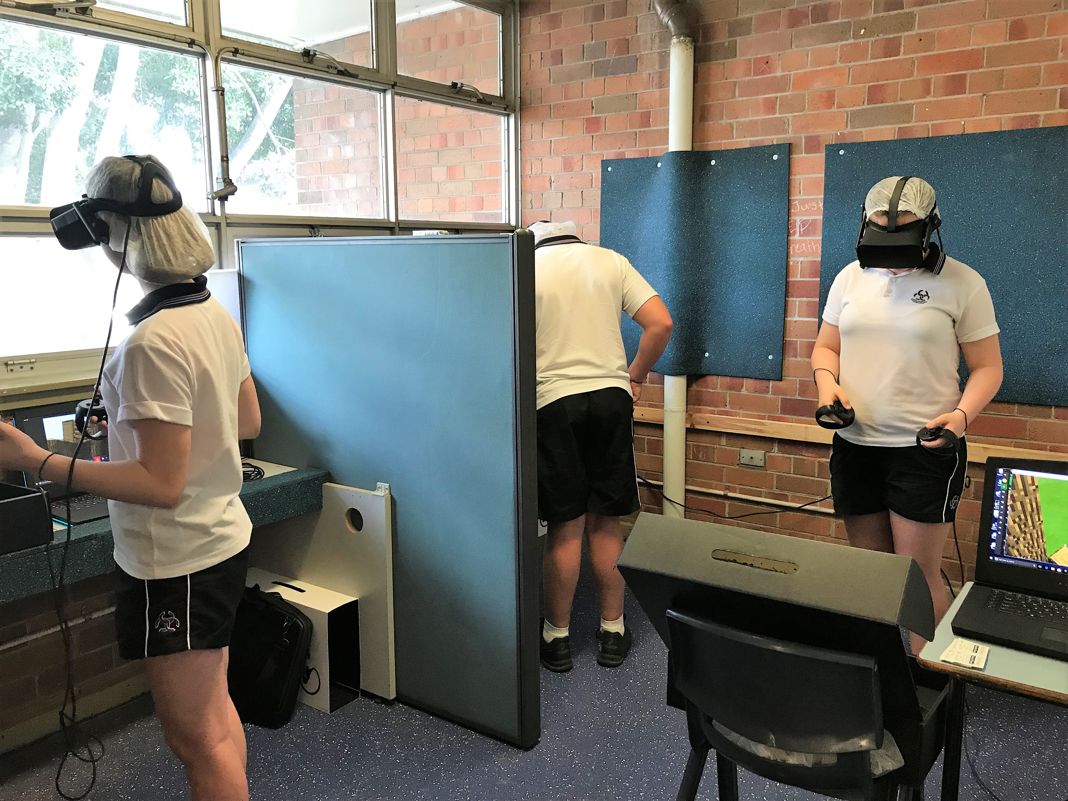 Image of three students using VR headsets