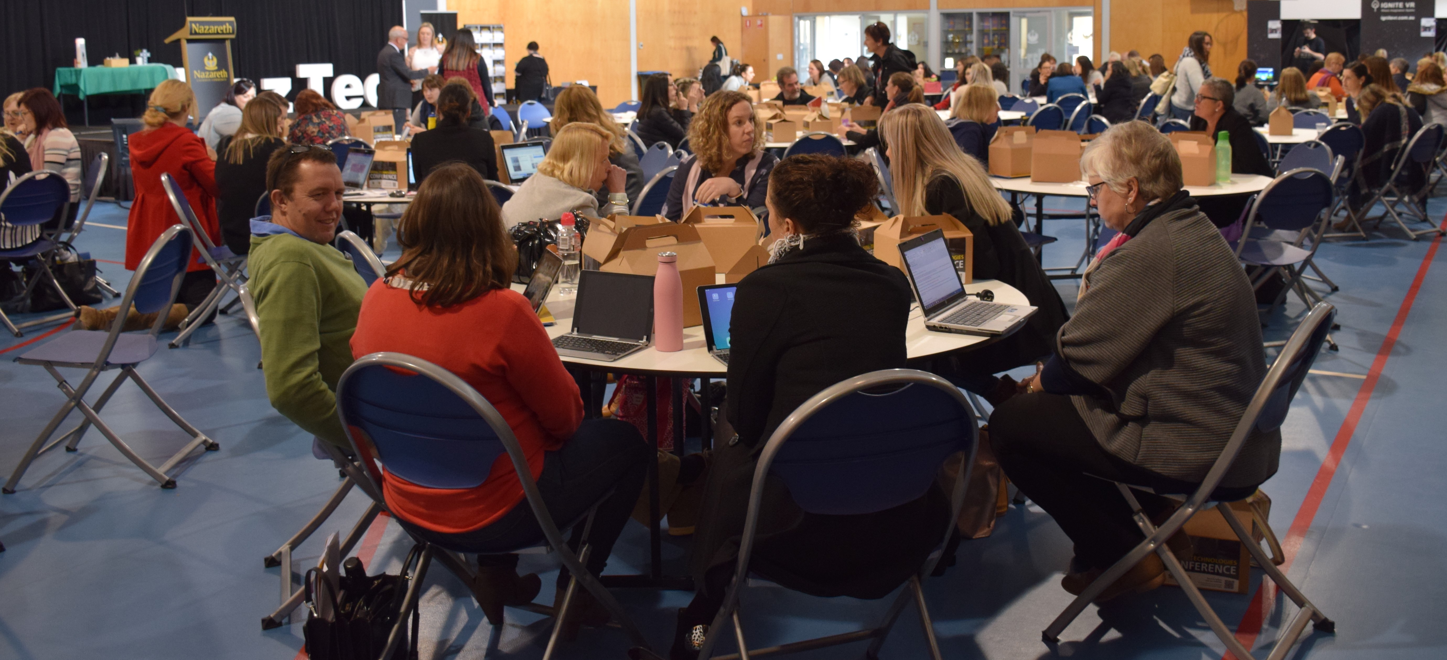 View of the conference room and teachers seated at a table