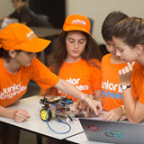 Image of students with robotic car