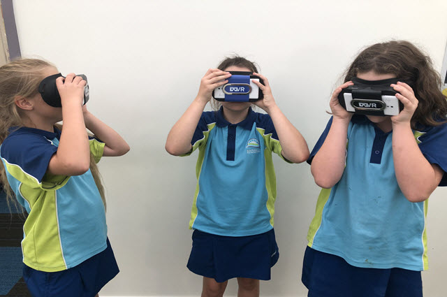Image of Three students using VR headsets