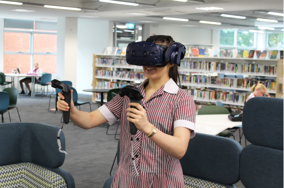 Image of a high school female student with a VR headset